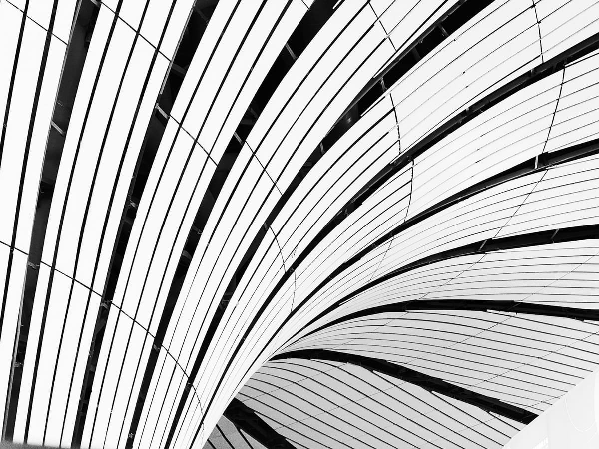 Abstract black-and-white architectural lines representing structured, evidence-based finance workflows.