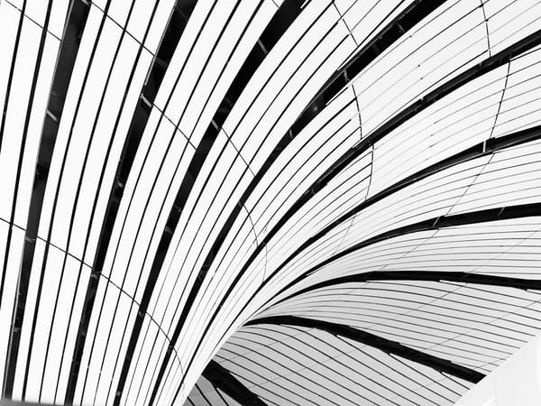 Abstract black-and-white architectural lines representing structured, evidence-based finance workflows.